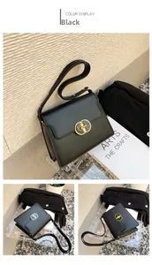 Détail du sac à bandoulière en cuir noir mat avec une boucle dorée ovale évidée élégante