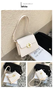 Détail du sac à bandoulière en similicuir blanc avec boucle dorée ronde et sangle réglable