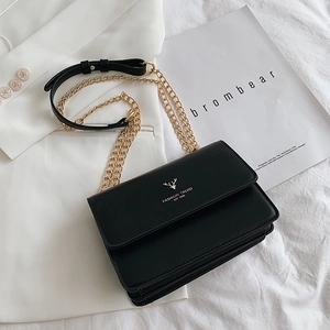 Fashionable black leather crossbody bag with gold deer logo and metal chain strap