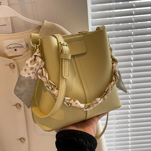 Yellow PU leather bucket bag with silk scarf chain handle and crossbody strap