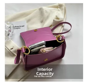Detailed view of purple crossbody bag interior capacity with smartphones and wallet