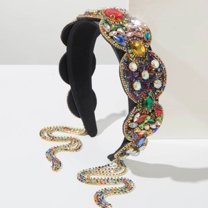 Detail of luxury baroque headband with colorful crystal flower clusters and rhinestone tassels