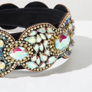 Macro detail of Baroque headband featuring iridescent crystals on a black fabric base