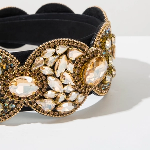 Macro view of luxurious Baroque headband with champagne crystals and golden bead details
