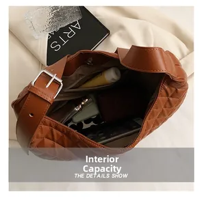 Interior capacity detail of brown quilted tote bag showing ample space for daily essentials