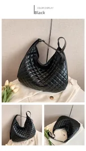 Detail of black quilted leather hobo bag with large capacity and adjustable wide strap
