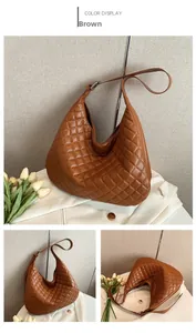 Detail view of brown quilted PU leather hobo bag with adjustable strap and crescent shape