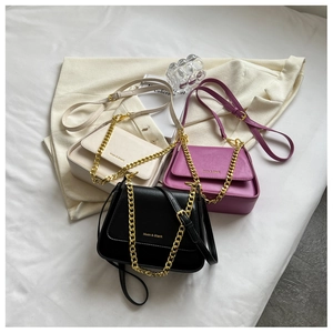 Detailed display of premium square crossbody bags in beige, purple, and black with gold chains