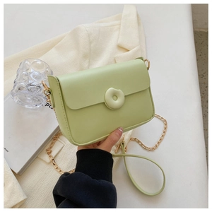 Fashionable light green square crossbody bag with decorative donut buckle and gold chain strap
