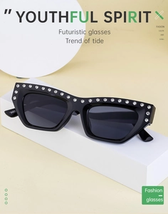 Detailed close-up of fashion cat eye sunglasses with rhinestones and 1980 logo on temple