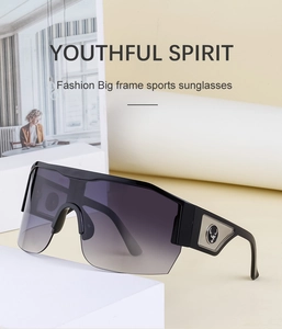Detail of silver stag logo on temple of Y2K sports sunglasses with gradient lenses