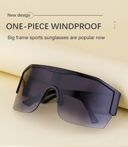 Detail of black semi-rimless Y2K sports sunglasses with grey gradient one-piece lens