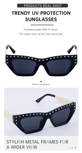 Detailed view of black cat eye sunglasses featuring crystal rhinestones and metal temples
