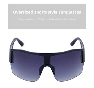 Close-up of oversized Y2K sports sunglasses with gradient lenses and semi-rimless frame