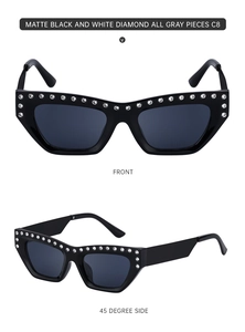 Detailed view of matte black cat-eye sunglasses with rhinestone inlay and gray lenses