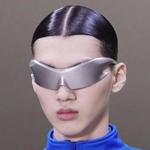 Side profile of silver Y2K futuristic wrap-around shield sunglasses with sleek metallic finish