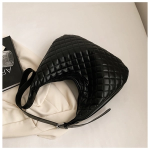 Detail view of the black quilted hobo bag with adjustable strap and silver hardware