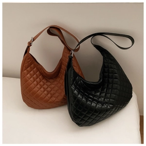 Detail view of adjustable strap buckles on black and brown quilted hobo bags