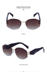 Detail view of dark brown rimless sunglasses with gold metal bridge and rivet accents