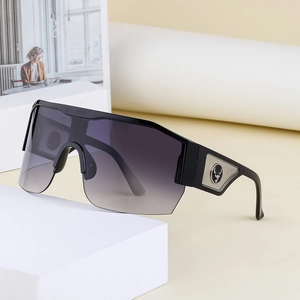 Chic Y2K semi-rimless oversized sunglasses with silver stag logo on white pedestal