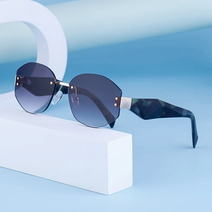 Fashion rimless polygon sunglasses with blue gradient lenses and marble pattern temples