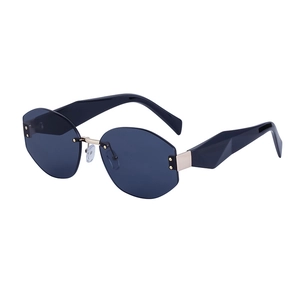 Fashion rimless geometric sunglasses with deep blue cut-edge lenses and thick black temples
