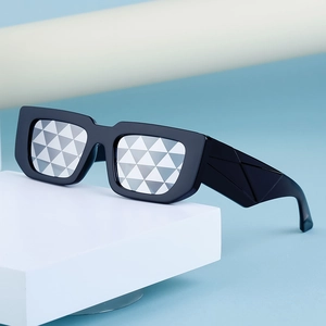 Fashionable square black sunglasses with silver geometric patterned lenses and wide textured temples