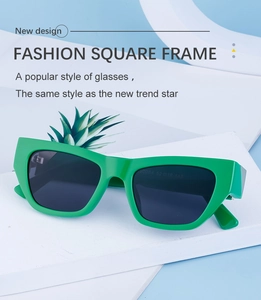 Close-up of bright green rectangular sunglasses with dark lenses on a white stand