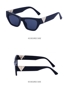 Detail of black cat-eye sunglasses with signature gold triangle hinge on the temple