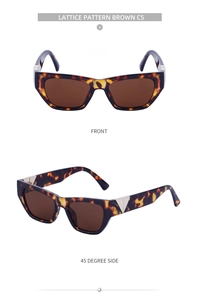 Detail of tortoise shell sunglasses with gold triangle accents and brown lenses