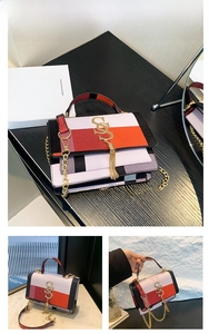 Detail of rose red patchwork shoulder bag with chain strap and tassel decoration