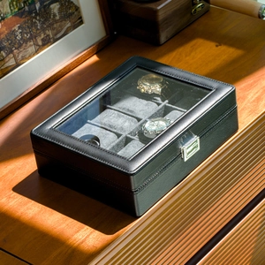 Detail of 12-slot PU leather watch box featuring glass window and silver metal lock