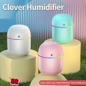 Mini USB clover humidifier with colorful LED lights in pink, white, and green
