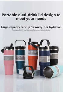 Detailed view of 30oz insulated travel tumblers in multiple colors with foldable handles
