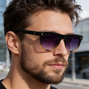 Detail of square vintage sunglasses with purple gradient lenses and gold arrow hinges