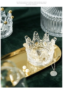 Detailed view of crown-shaped glass jewelry storage dish with elegant gold bead edge detailing