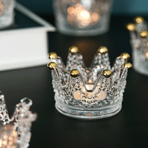 Elegant crown shaped glass jewelry organizer and candle holder with golden bead accents