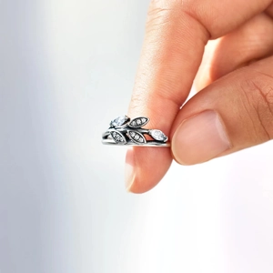Macro shot of silver leaf ring featuring marquise-cut stones and sparkling zirconias