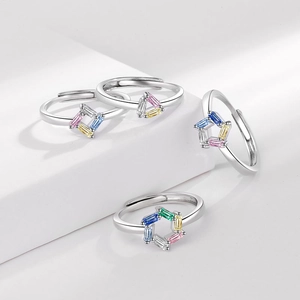 Set of four adjustable silver rings with colorful baguette-cut geometric zircon stones
