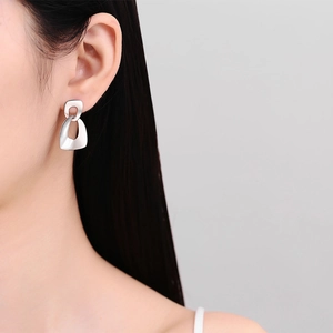 Minimalist silver S925 geometric nested ring earrings on model for a trendy look