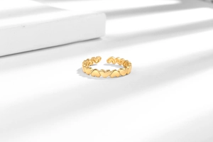 Macro detail of S925 sterling silver stamp on the inner band of the golden heart ring