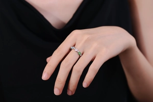 Close-up of floral ring with colorful daisy charms and micro-set cubic zirconia