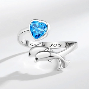 Adjustable silver dolphin ring with a blue heart gemstone and I Love You engraving