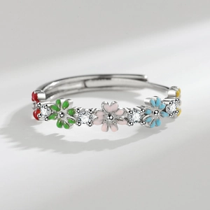 Adjustable silver flower ring with five colorful enamel daisies and sparkling cubic zirconia