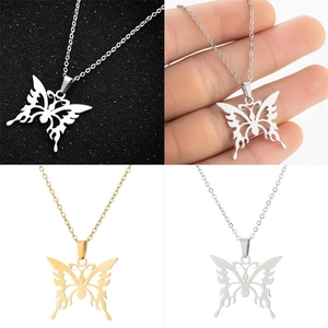 Detail views of gold and silver butterfly pendant necklace with hollow butterfly design