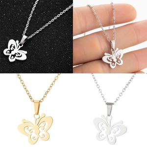 Detail view of hollow butterfly pendant in gold and silver finishes on a thin chain