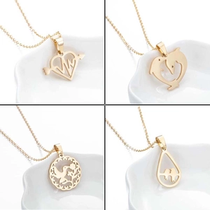 Set of four gold-plated stainless steel necklaces with heart, dolphin, and leaf pendants
