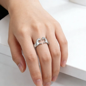 Minimalist silver heart hands gesture open ring for couples in a romantic modern design