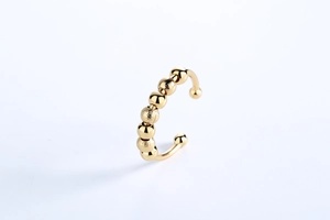 Detailed shot of golden adjustable ring with alternating polished and frosted beads