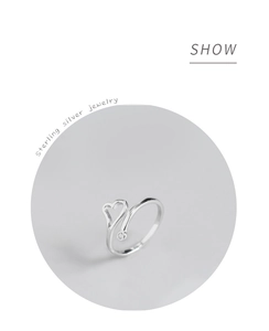 Detail of silver sterling silver wrap ring with hollow heart and zircon stone